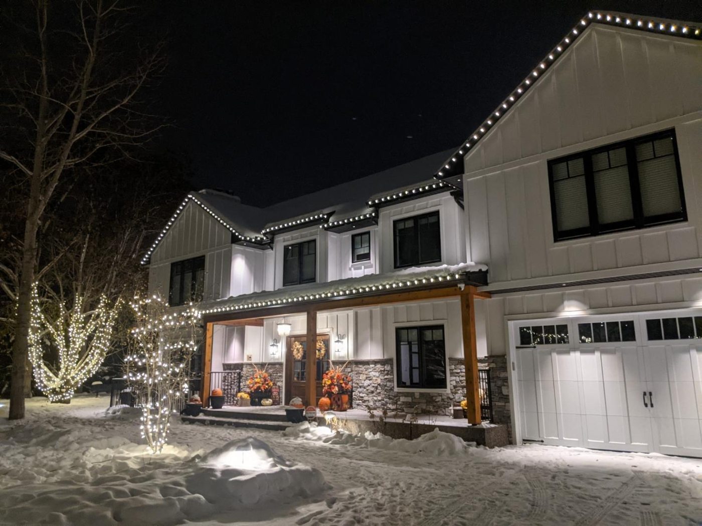 Warm-white permanent lighting on a two-storey home